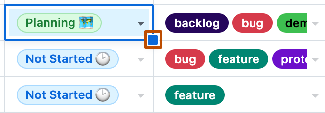 Screenshot showing two columns on a table layout. The blue handle, on the lower right of the selected cell, is highlighted with an orange outline.